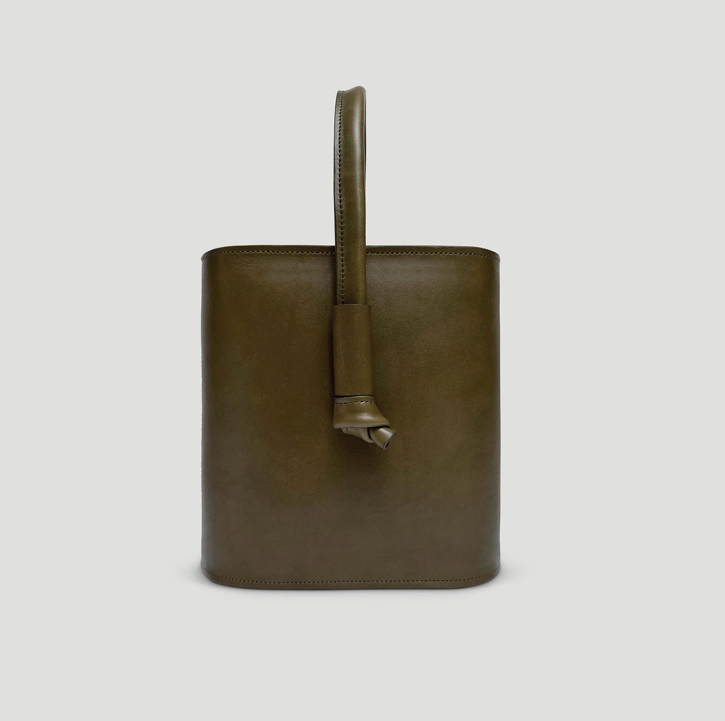 product shot of the juniper green basader full grain bucket bag